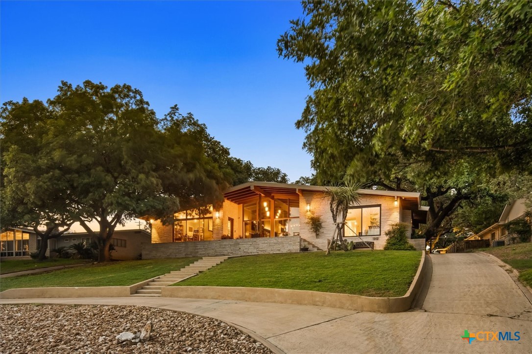 a front view of a house with a yard