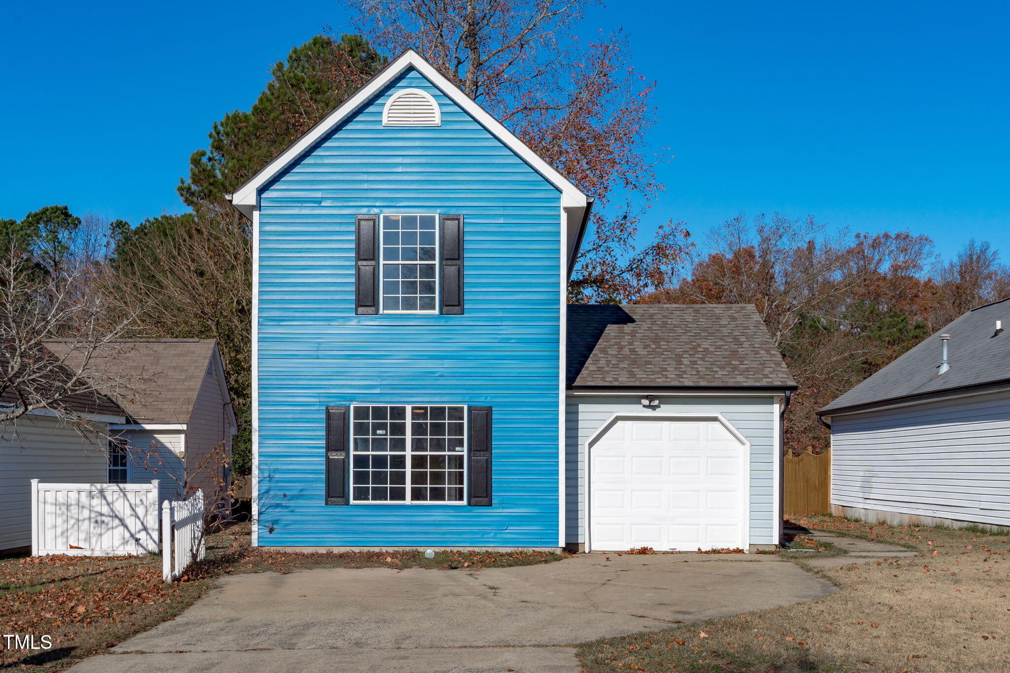 a front view of a house with a garage