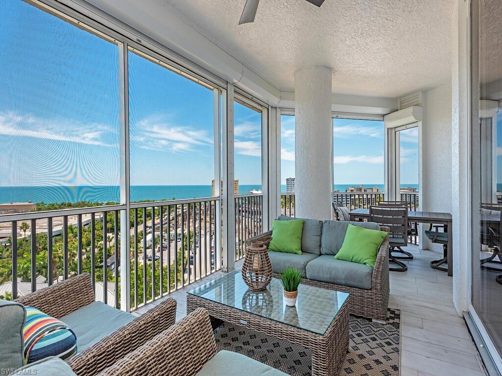 a balcony with furniture and city view