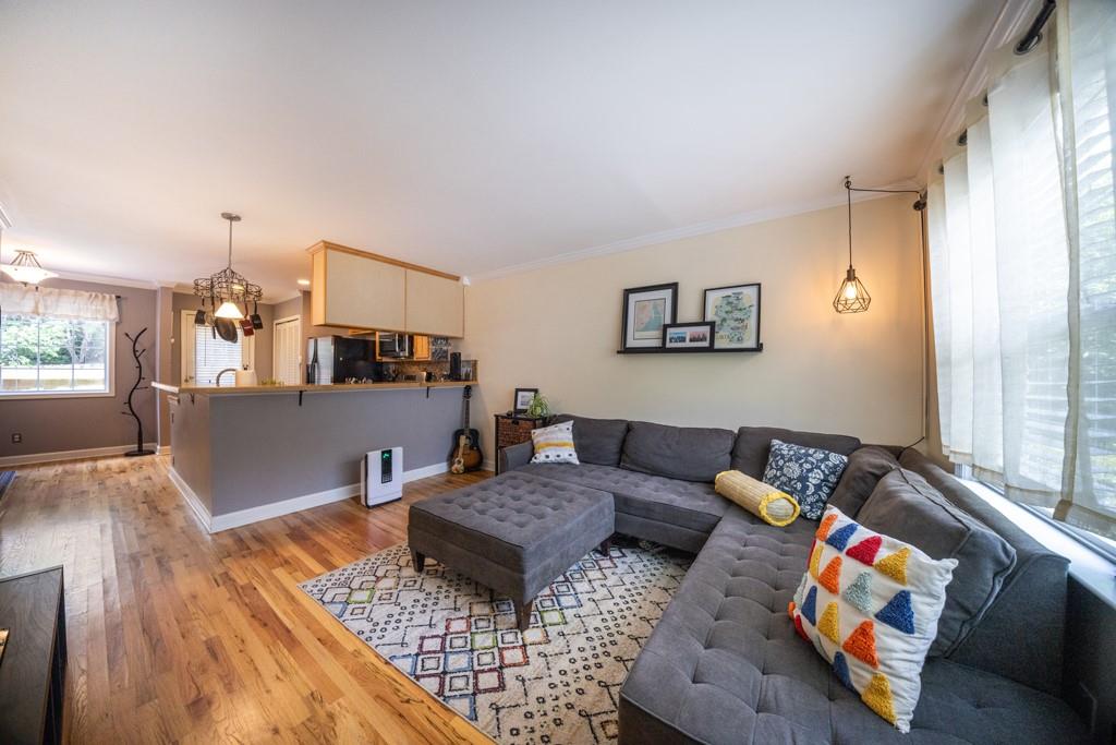 a living room with furniture and a table