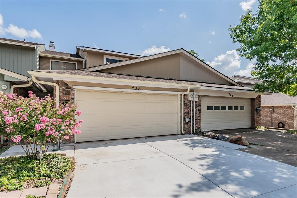 a front view of a house with a garage