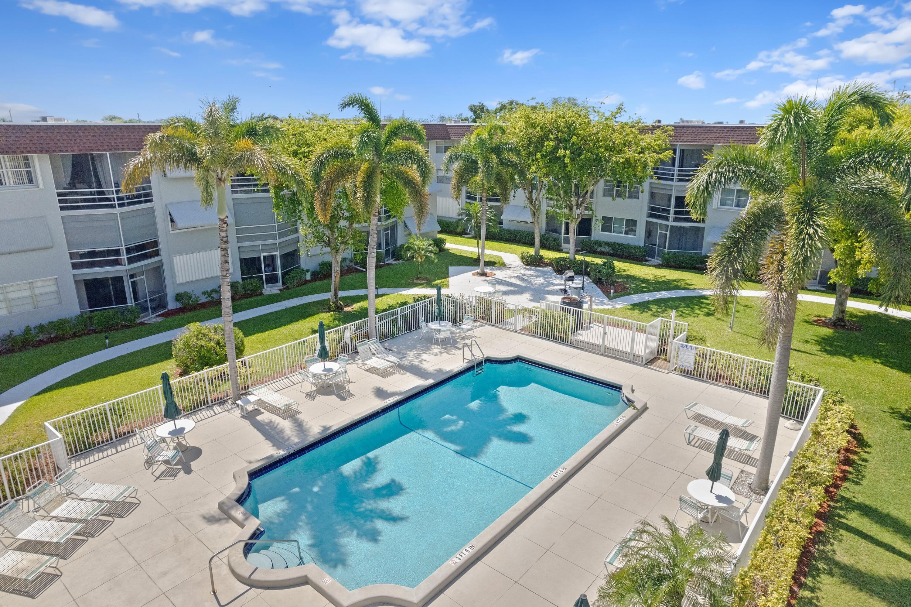 a view of a swimming pool with a patio