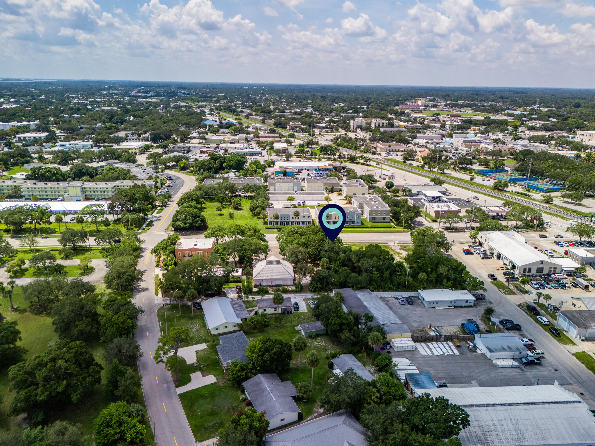 an aerial view of residential houses with outdoor space