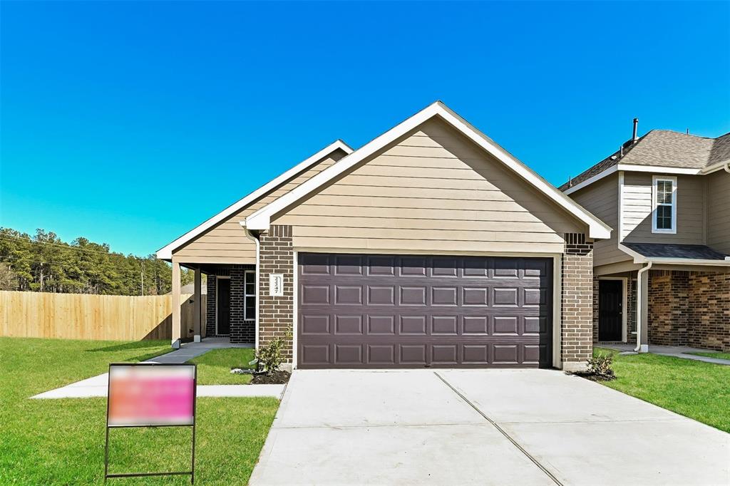 a front view of a house with yard