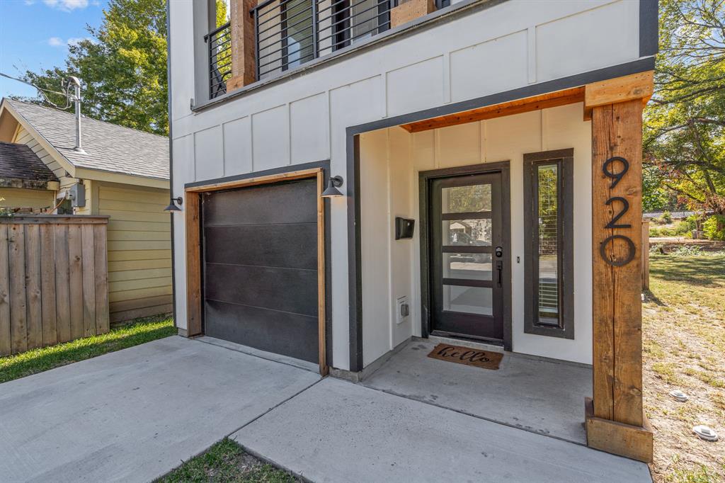 a view of a house with a door and wooden walls