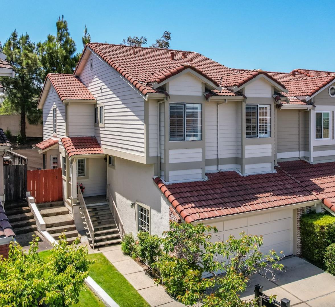 a view of a house with a yard and plants