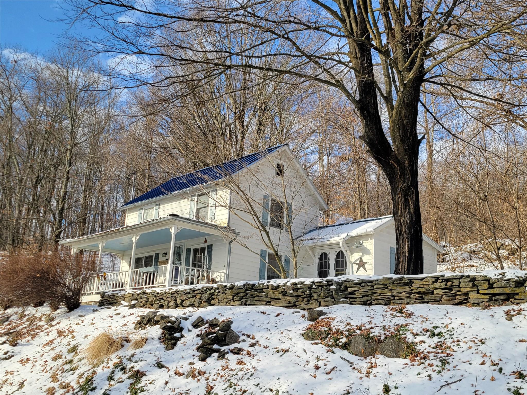 View of front of home featuring covered porch