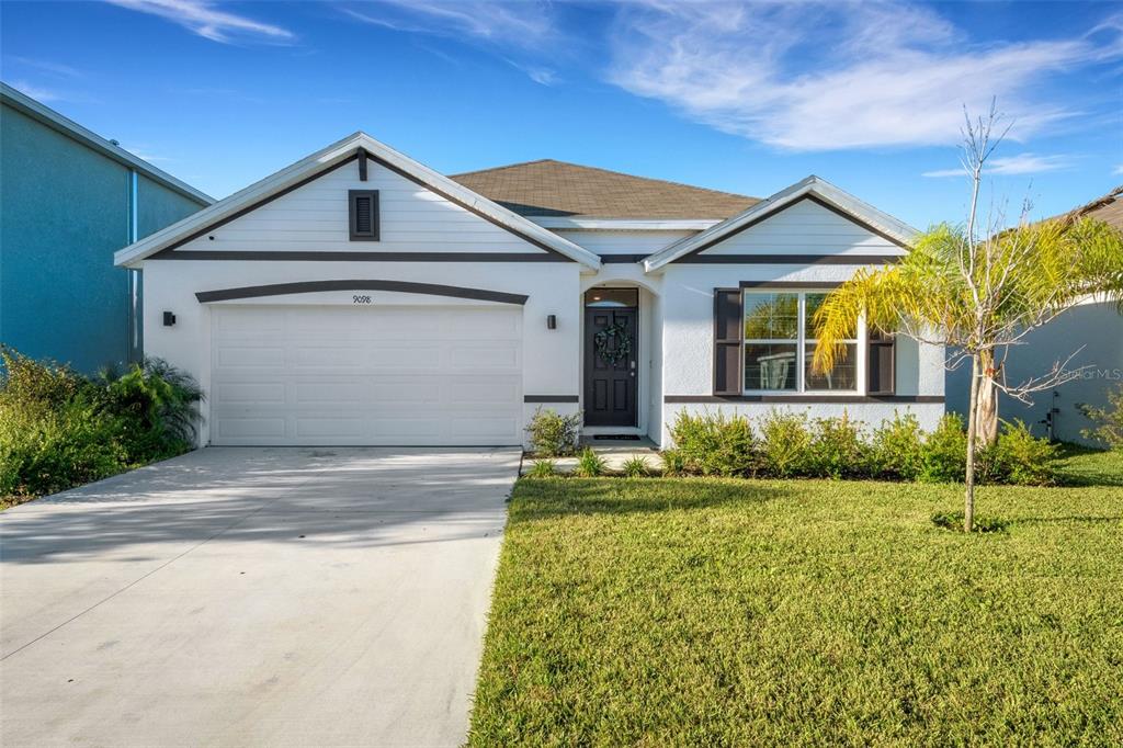 a front view of a house with a yard