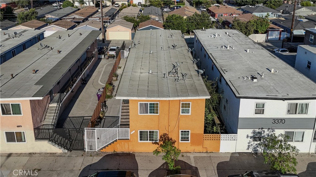 an aerial view of a residential apartment building with a yard