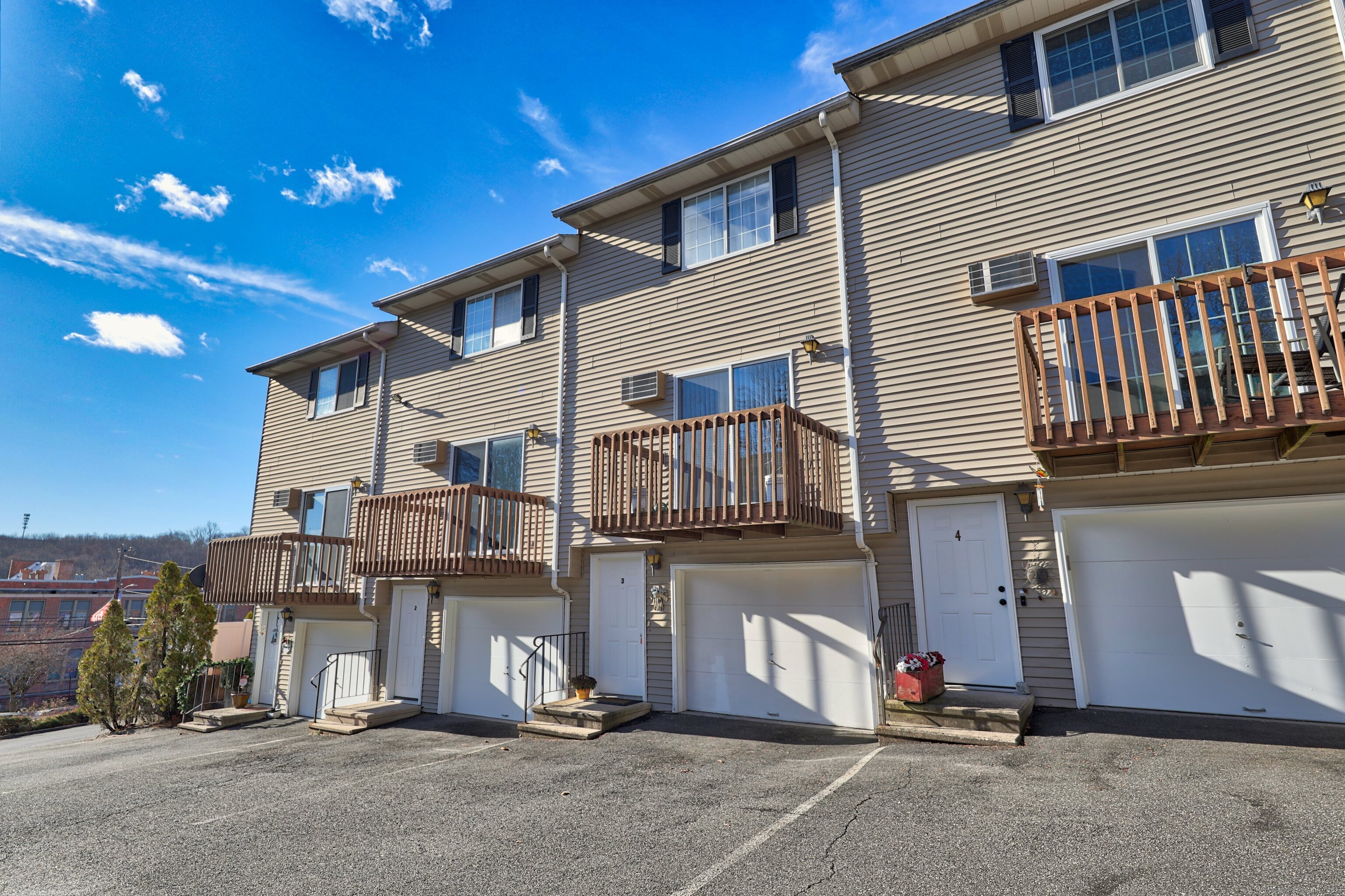 a view of a house with a parking space