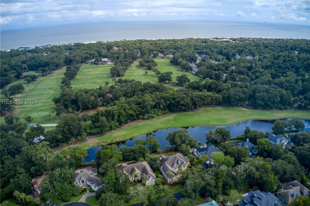 Birds eye view of property with ocean in the backg