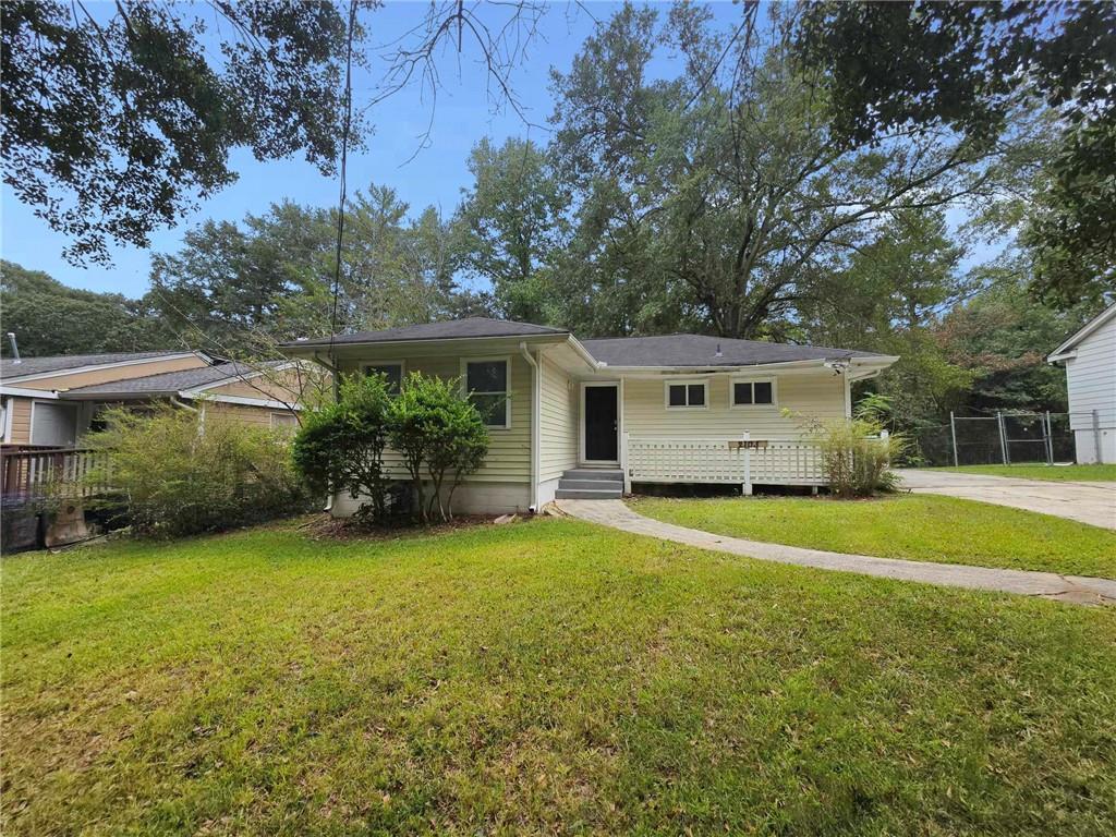 a front view of house with yard and green space