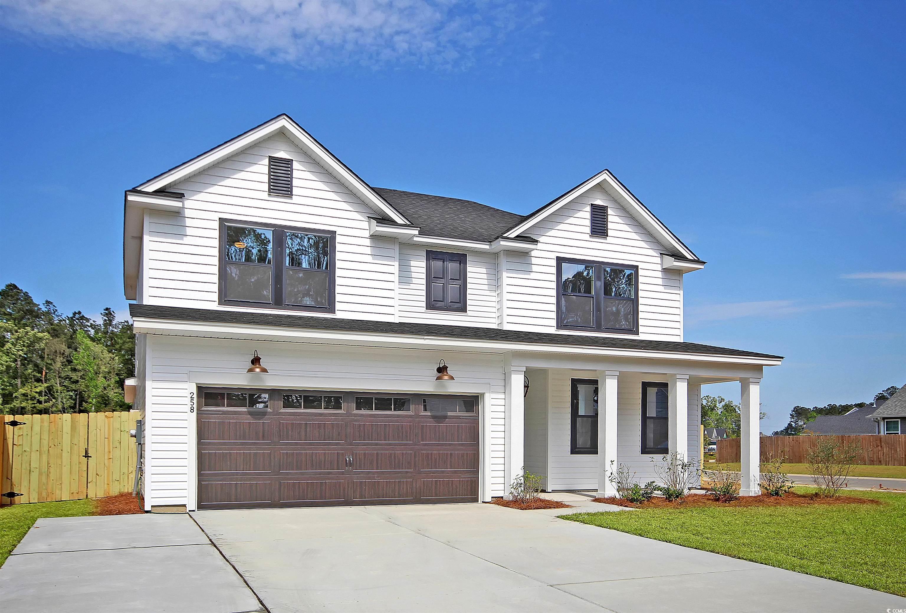 View of front of house featuring covered porch and