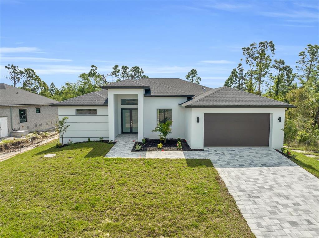 a view of house with swimming pool outdoor seating and house in the background