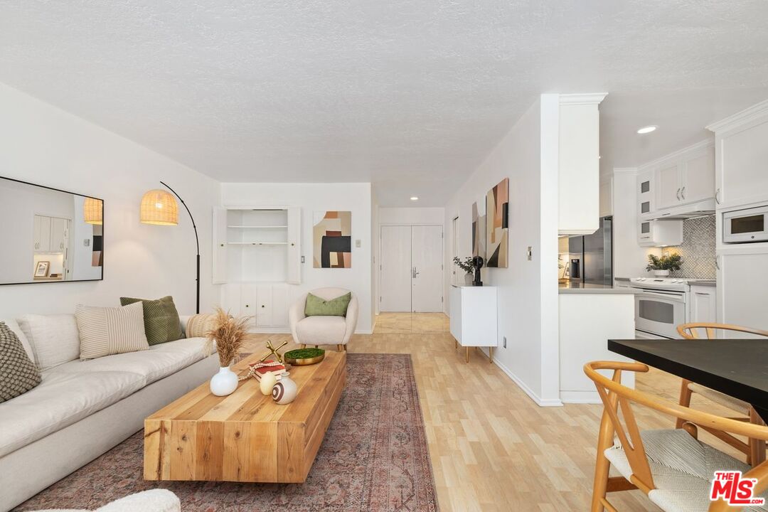 a living room with furniture and a rug