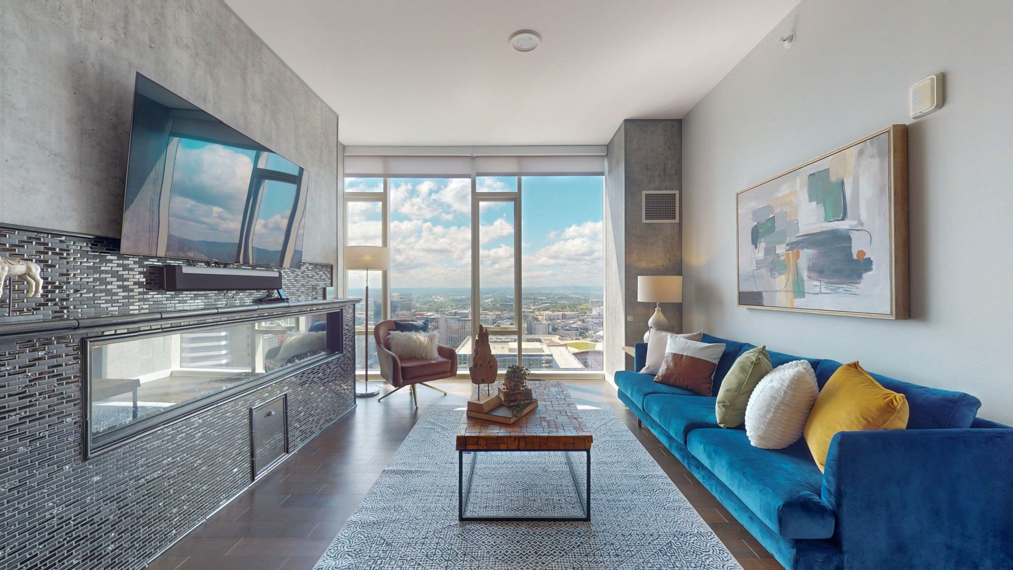 a living room with furniture and a flat screen tv