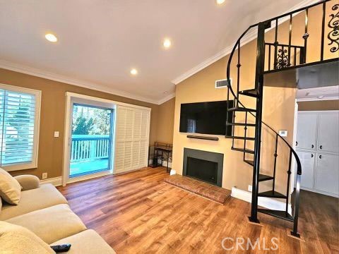 a bedroom with furniture fireplace and flat screen tv