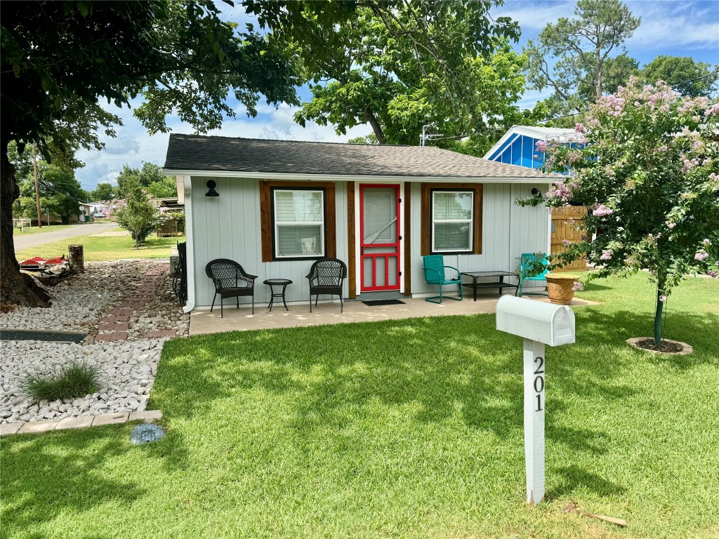 a front view of a house with garden