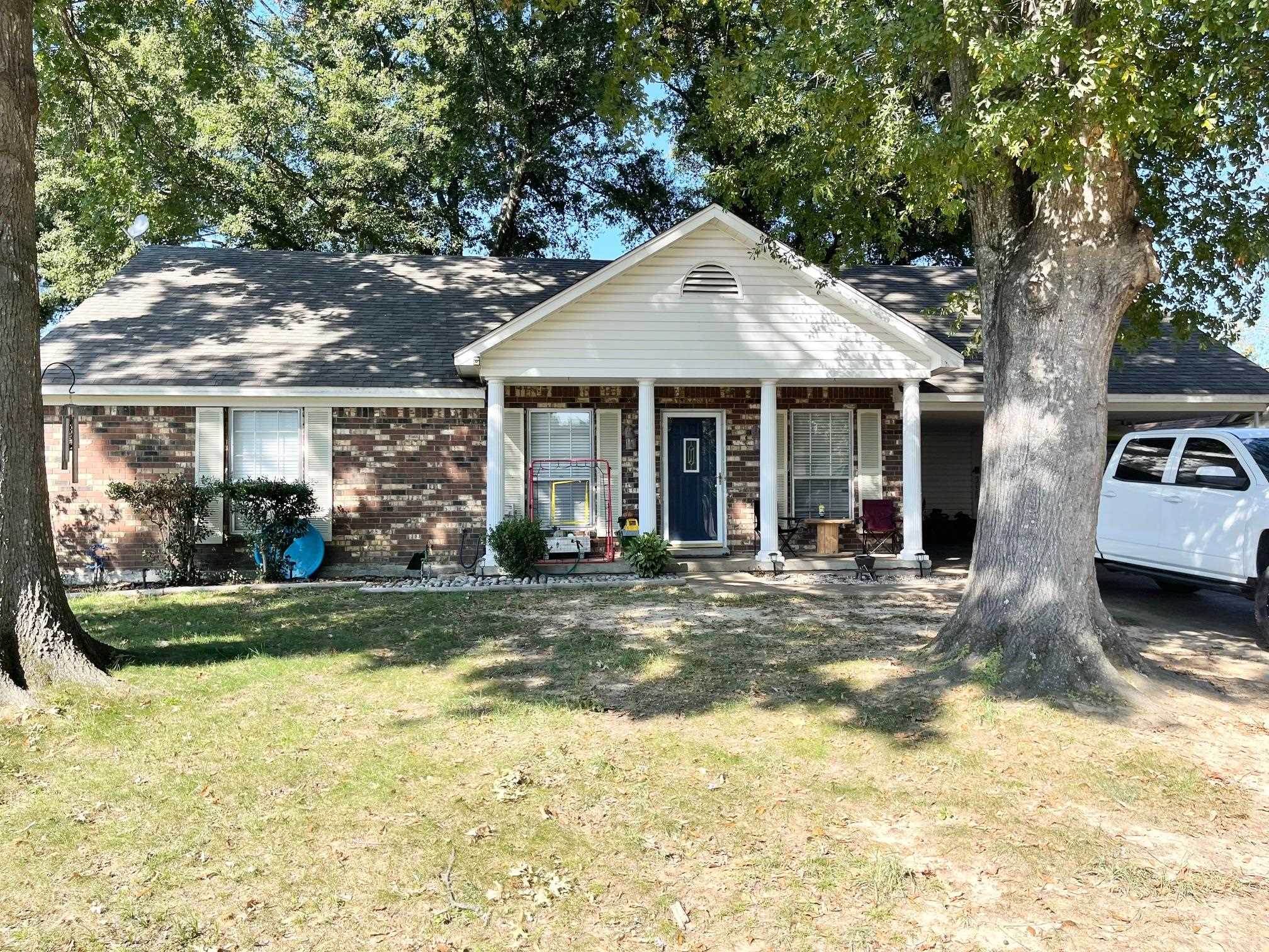 a view of a house with garden and porch