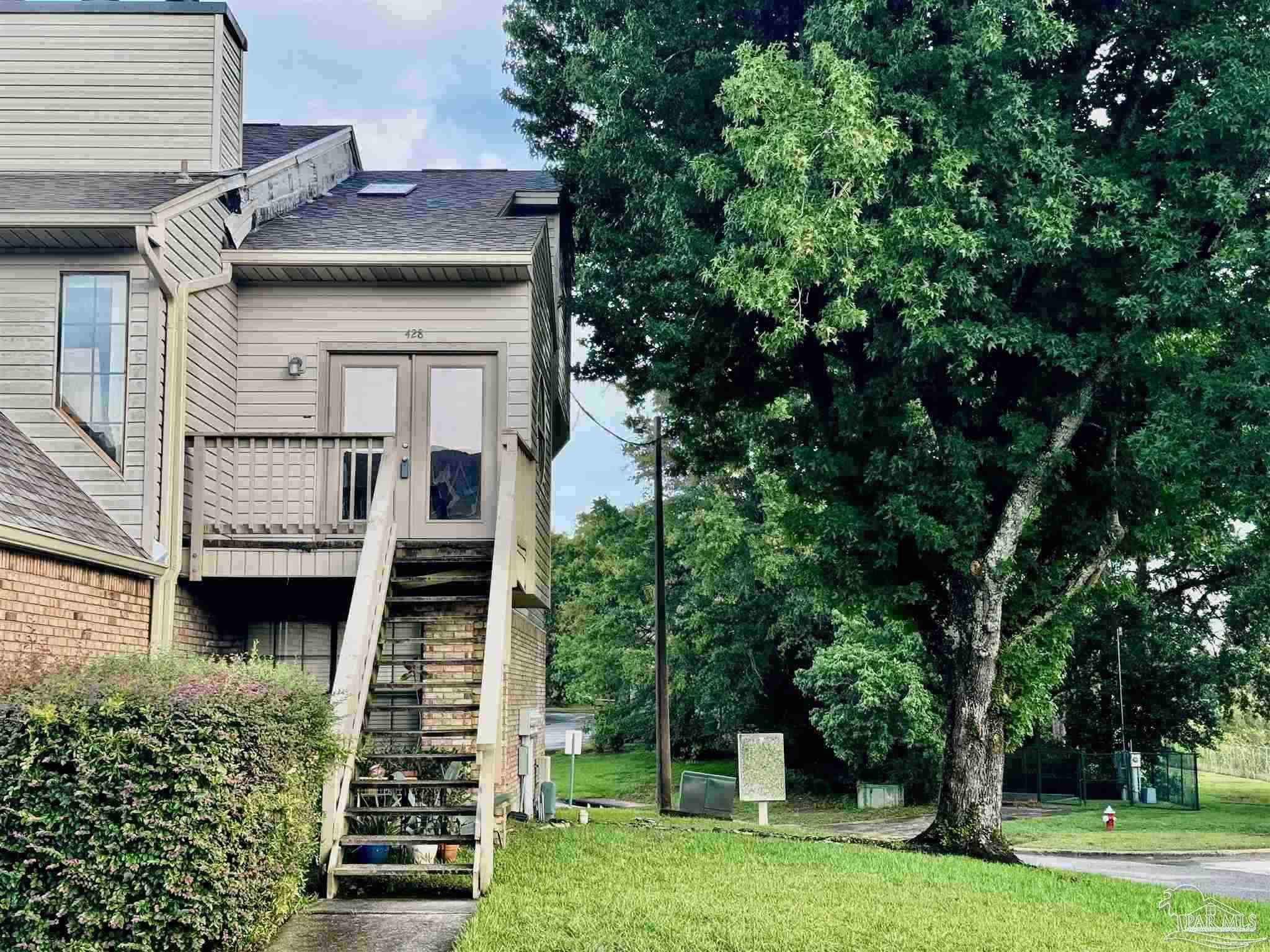 a view of house with yard