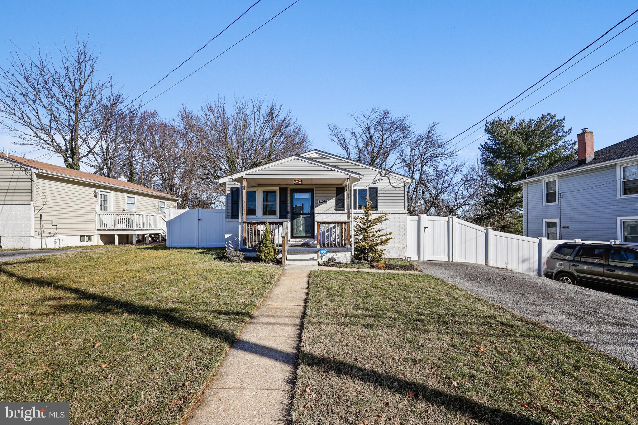 a view of a house with backyard porch and sitting area