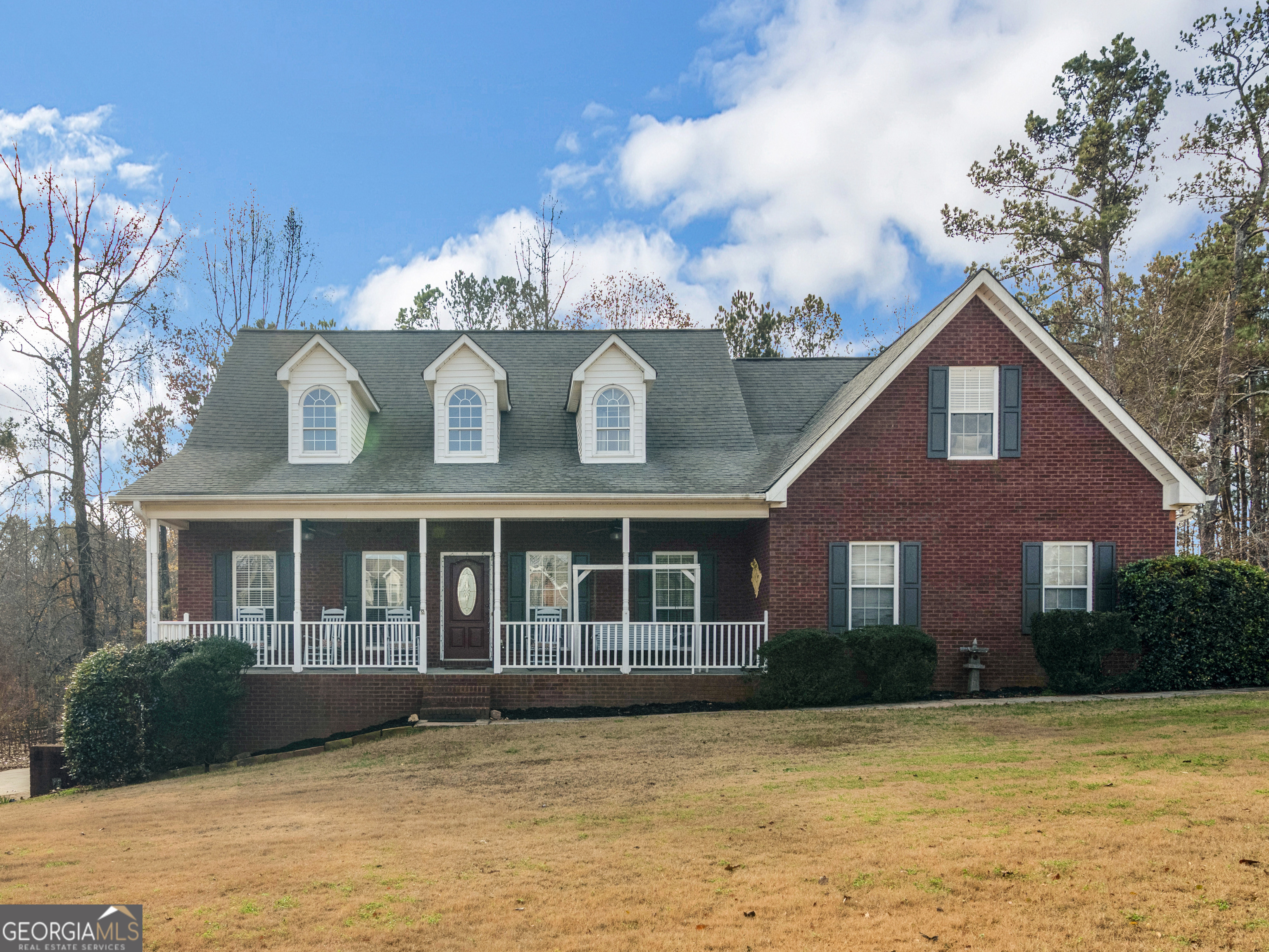 a front view of a house with garden