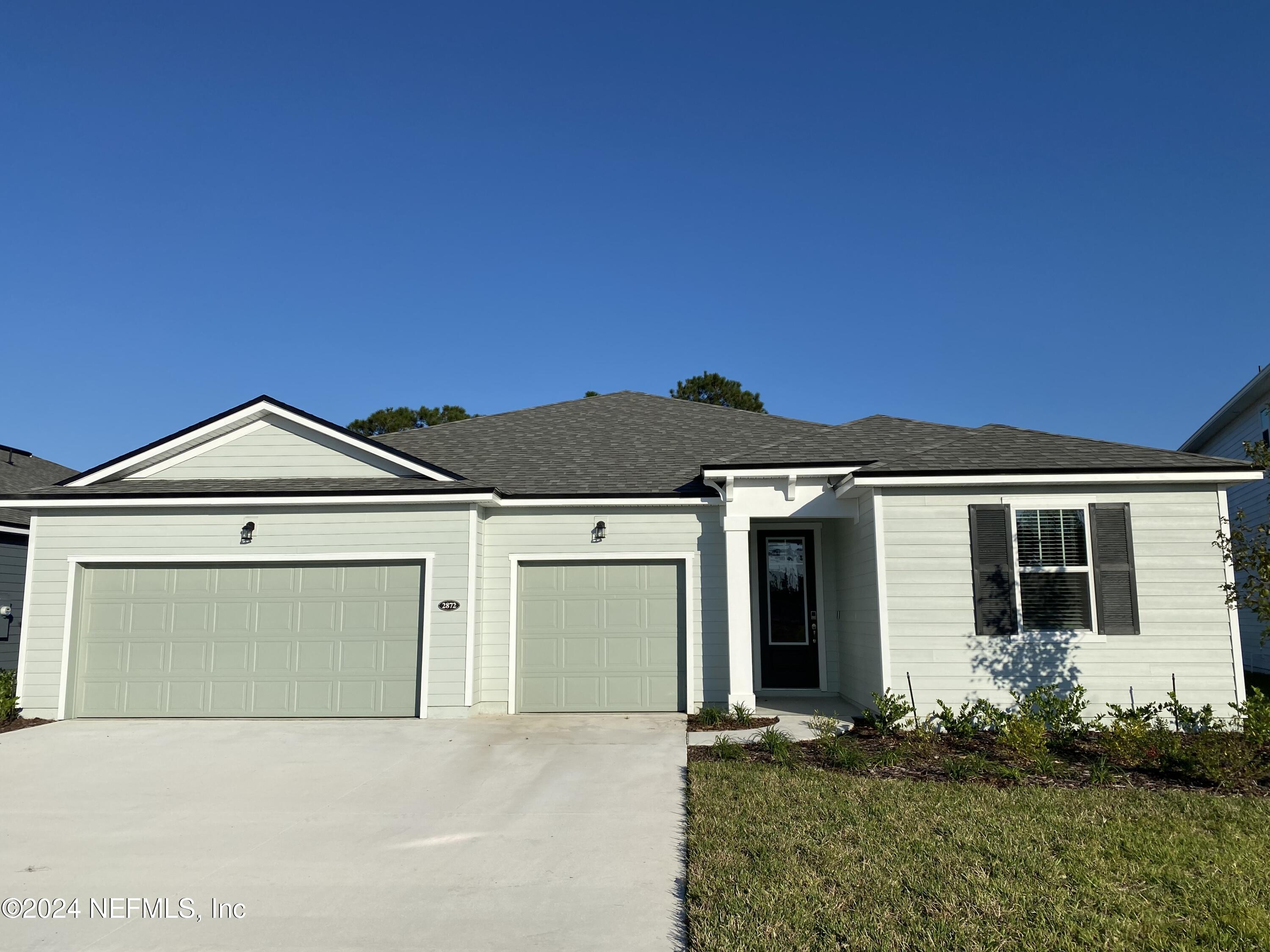 front view of a house with a yard