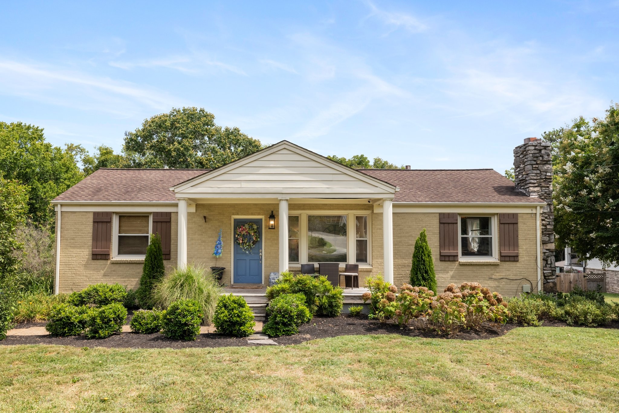 front view of a house with a yard