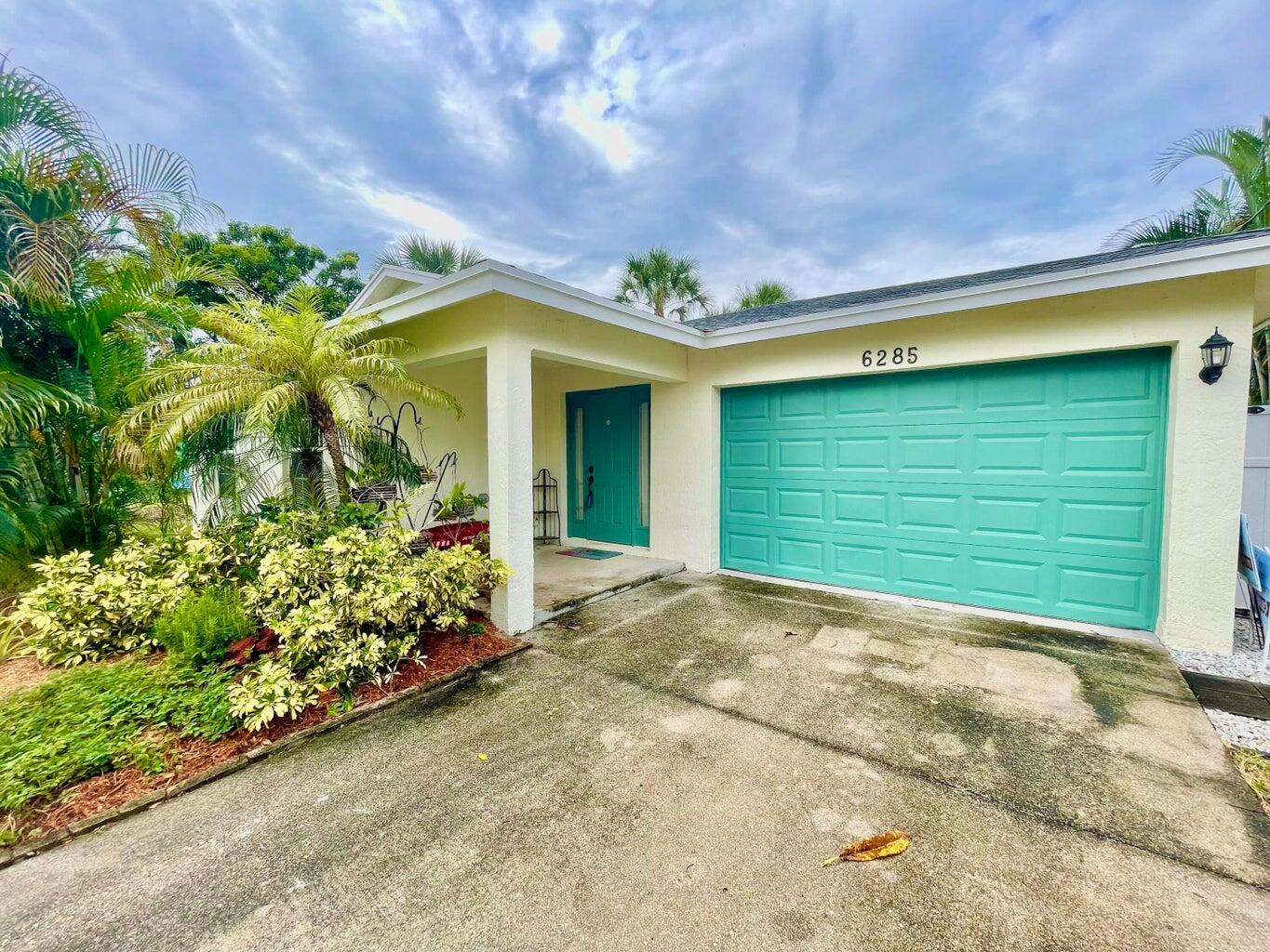 a view of a house with a garage