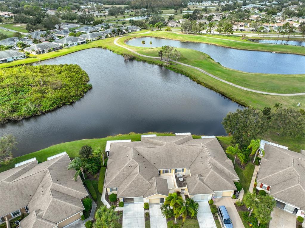 an aerial view of a house with a swimming pool