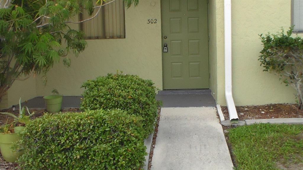 view of a pathway both side of house