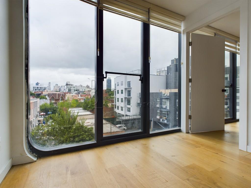 an empty room with large window