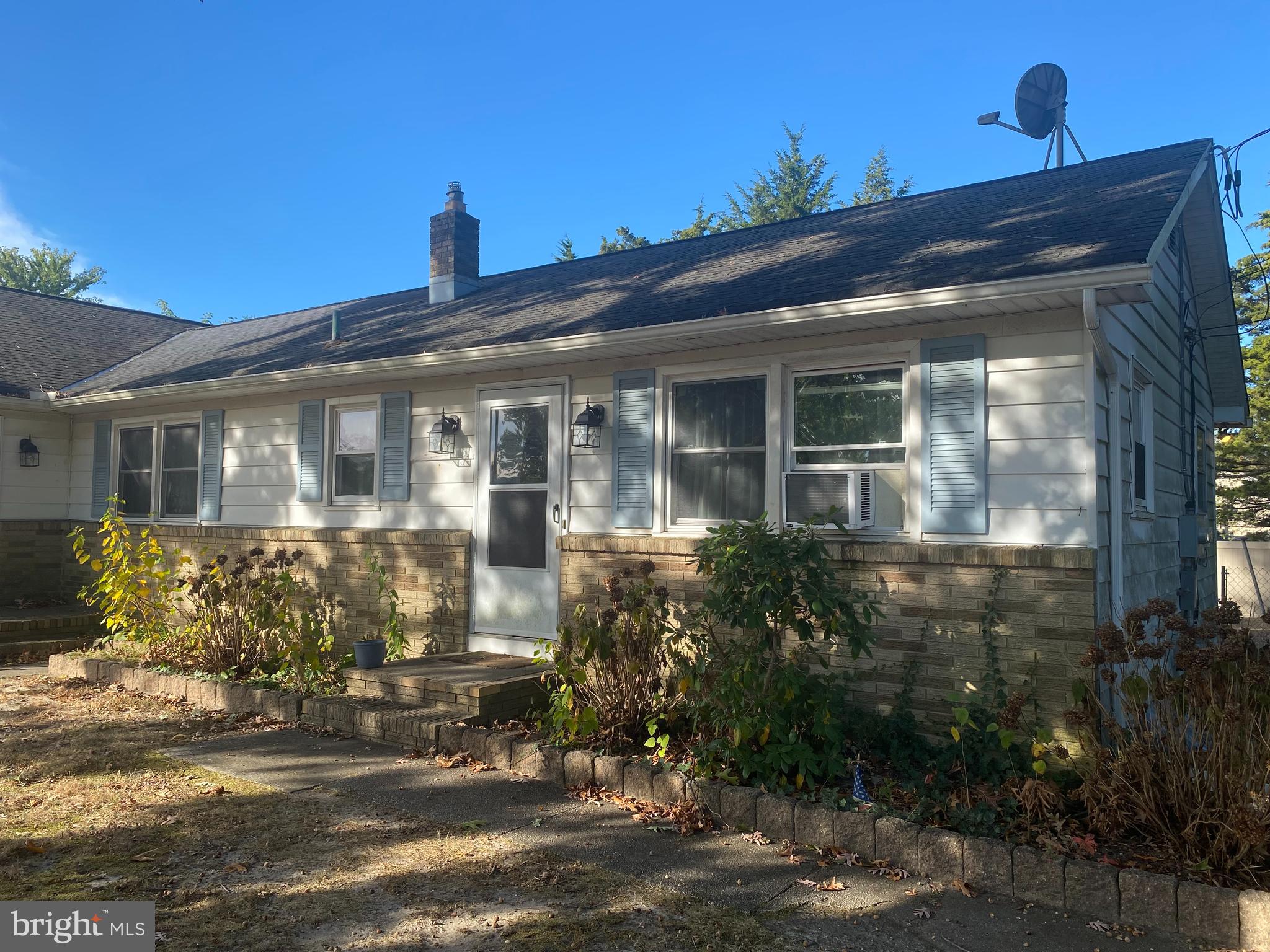 a front view of a house with yard