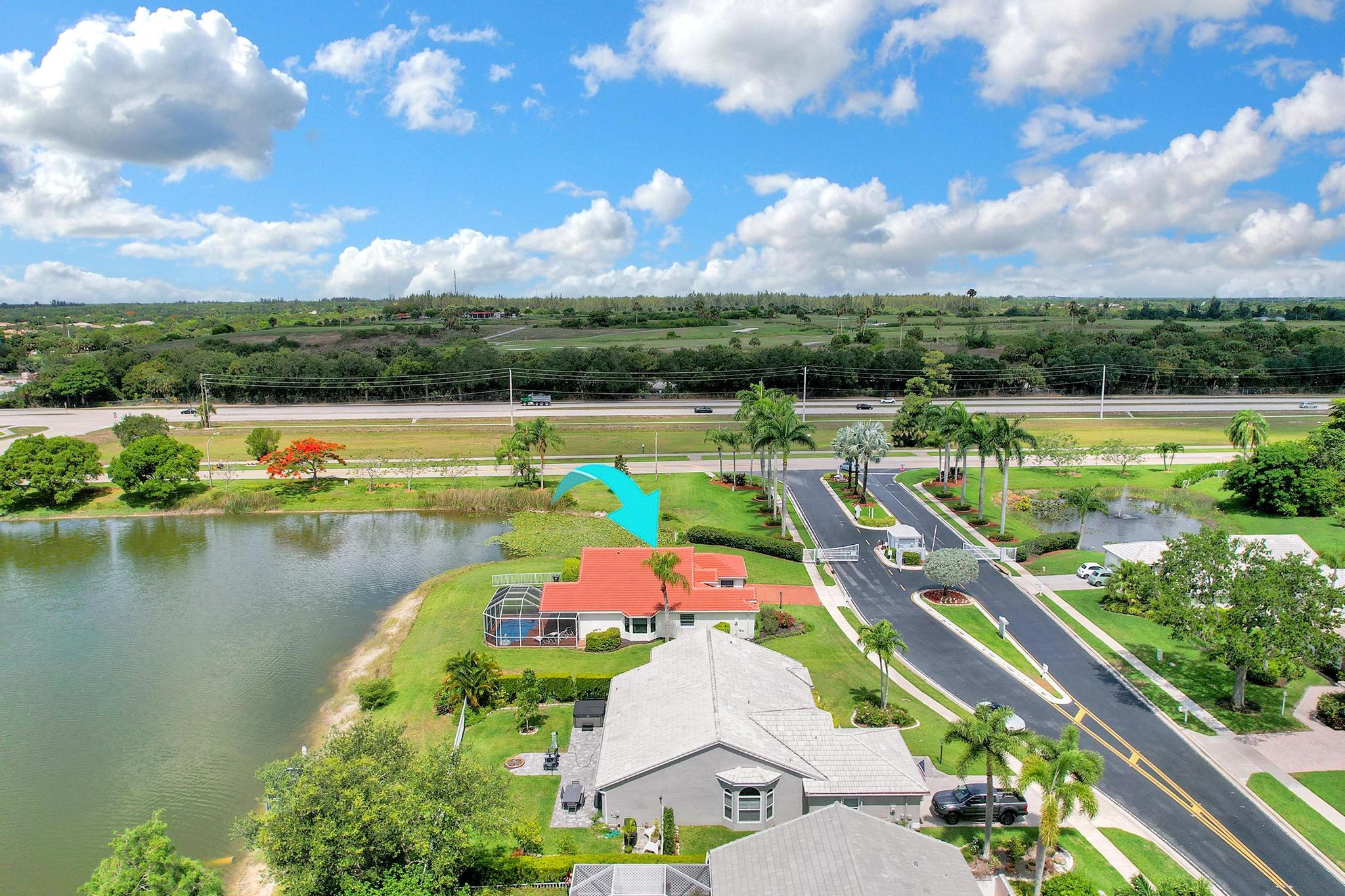 an aerial view of a house with a lake view