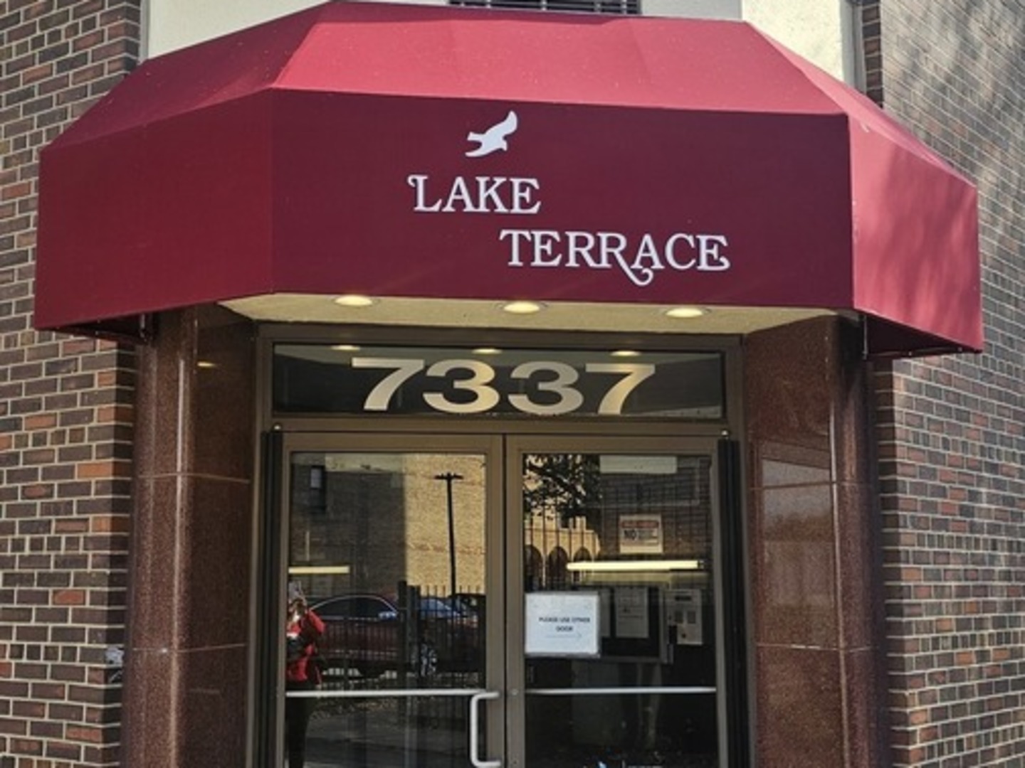 a view of a sign board with a red gate