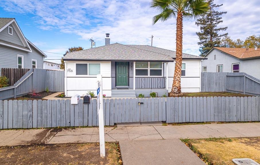 front view of a house with a fence