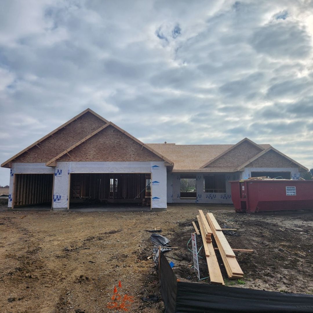 a view of a house with wooden fence