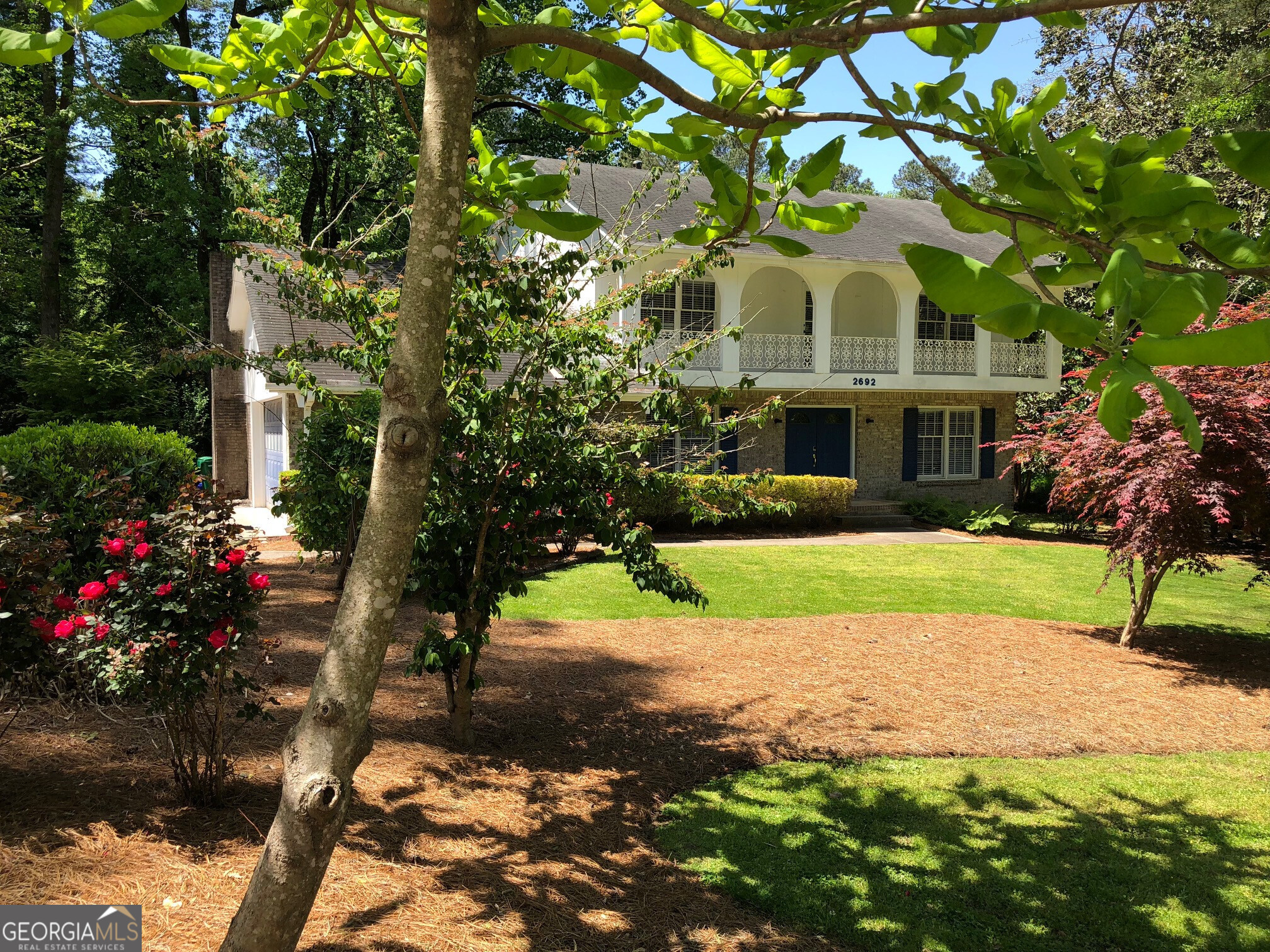 a view of house with yard