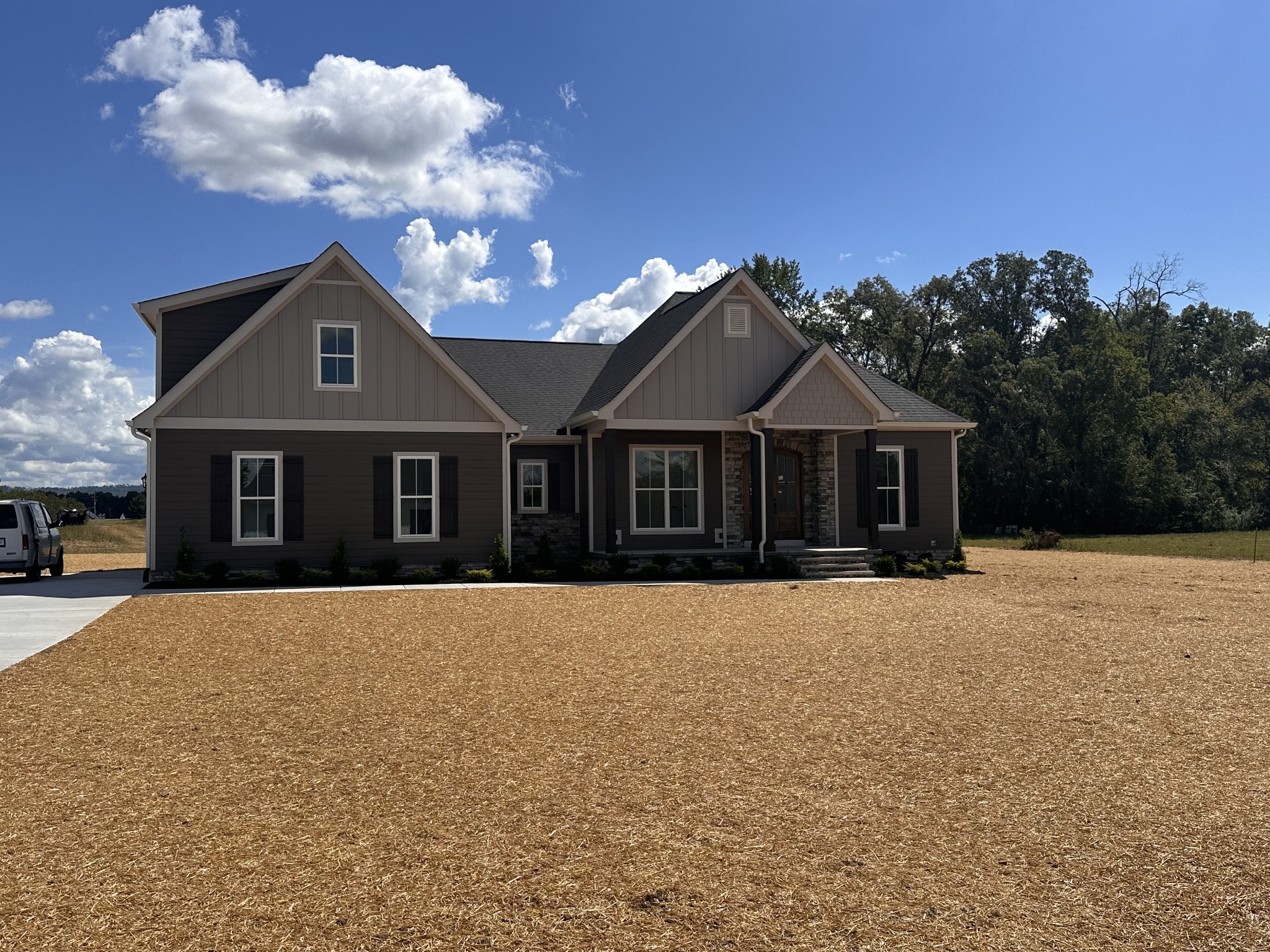 a front view of a house with yard