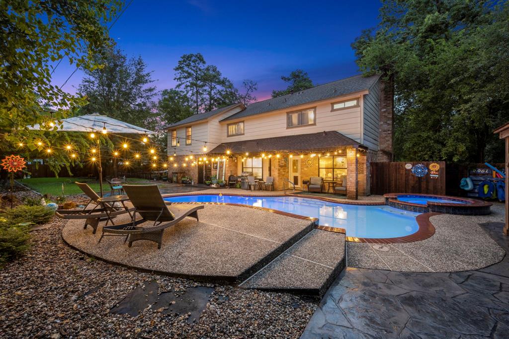 a view of a swimming pool with sitting area