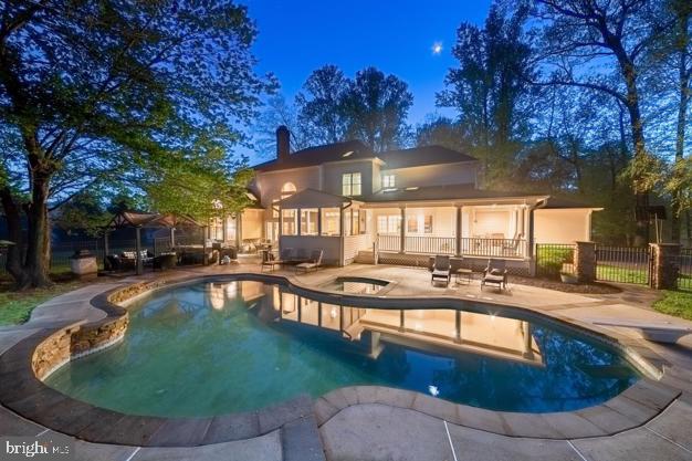 a view of a swimming pool with a patio