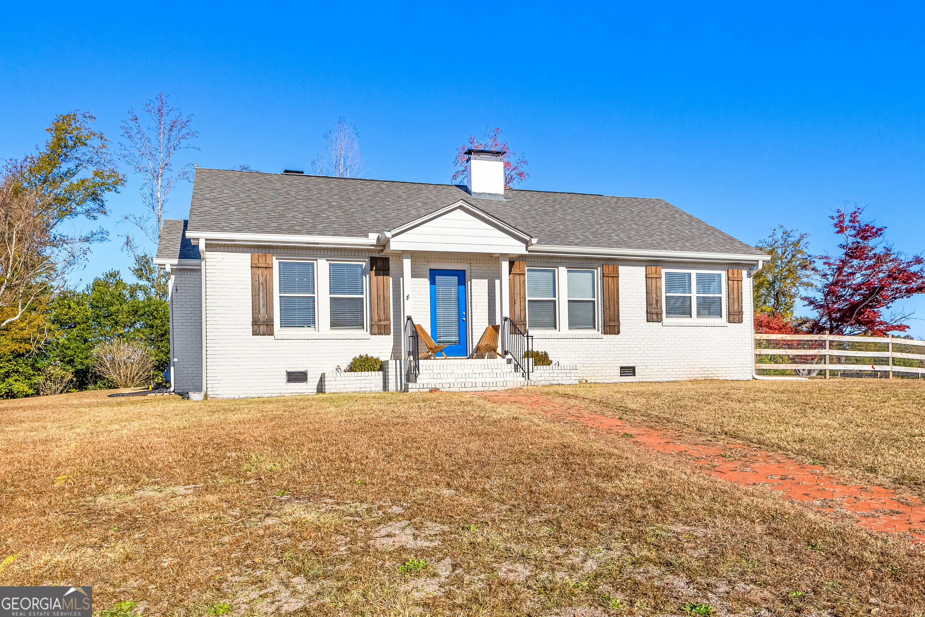 a front view of a house with a yard