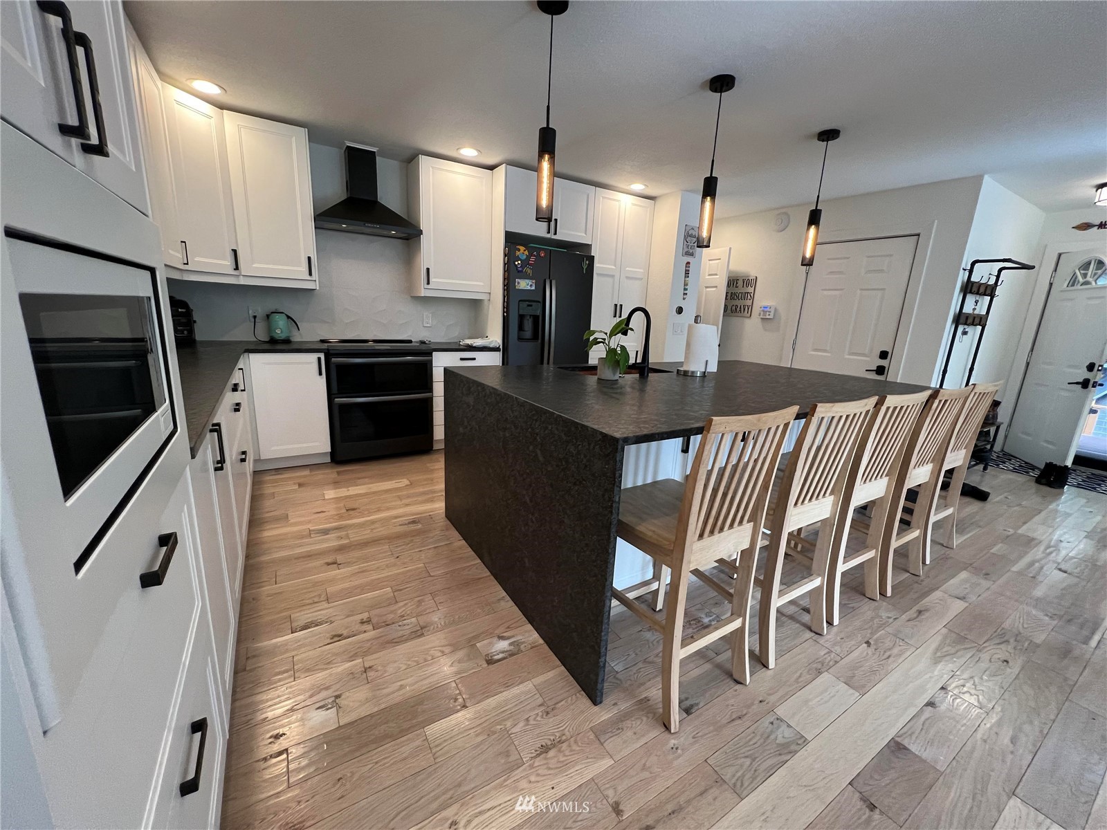 a kitchen with granite countertop sink cabinets and stainless steel appliances