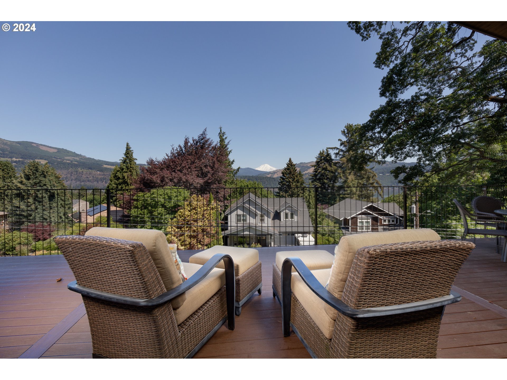 a view of a chairs and table in patio