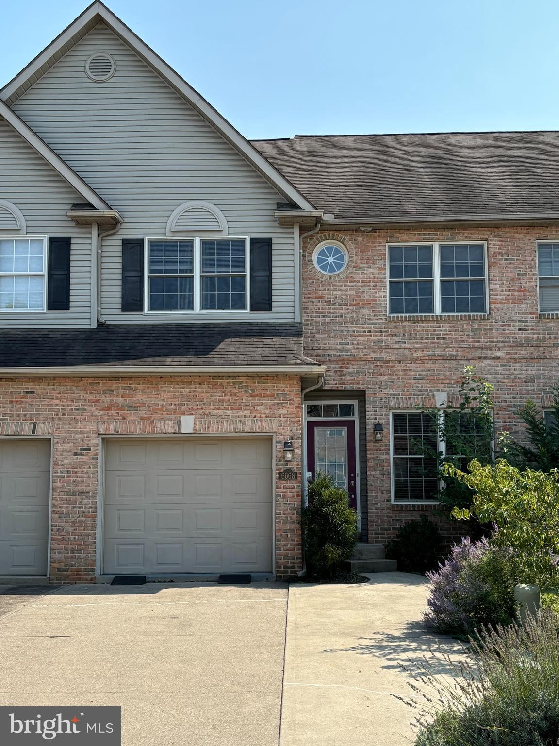 a front view of a house with yard