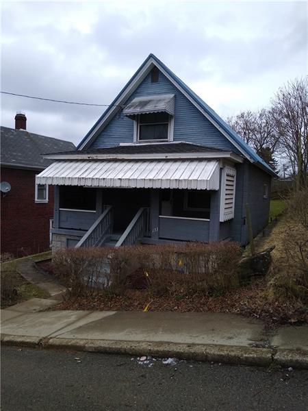 a front view of a house with garage