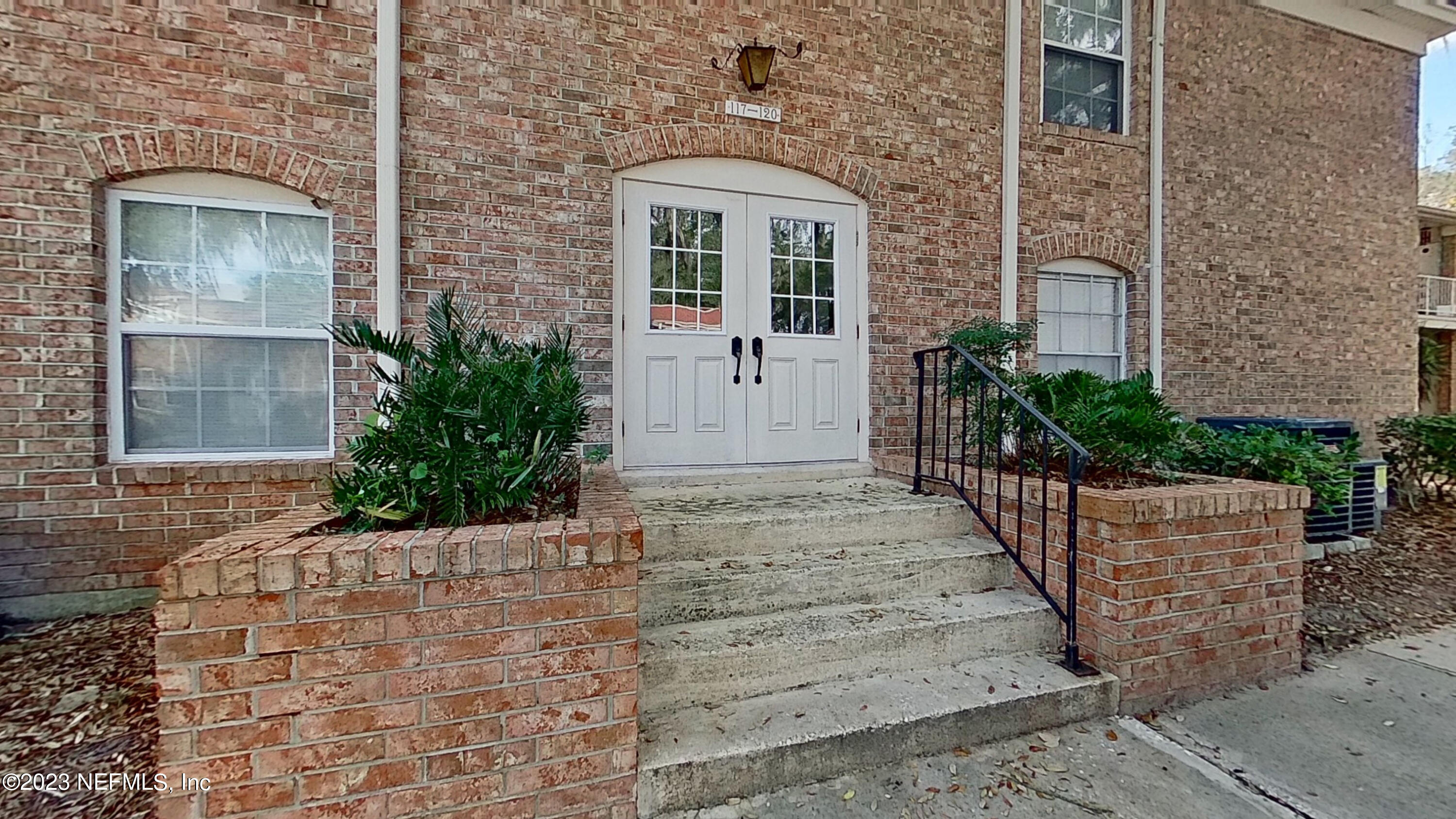 front view of a house with a garden