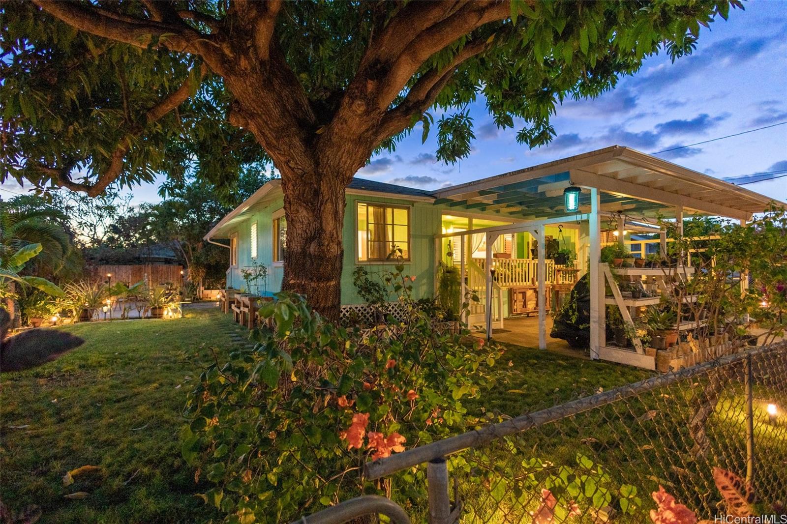 a front view of a house with garden