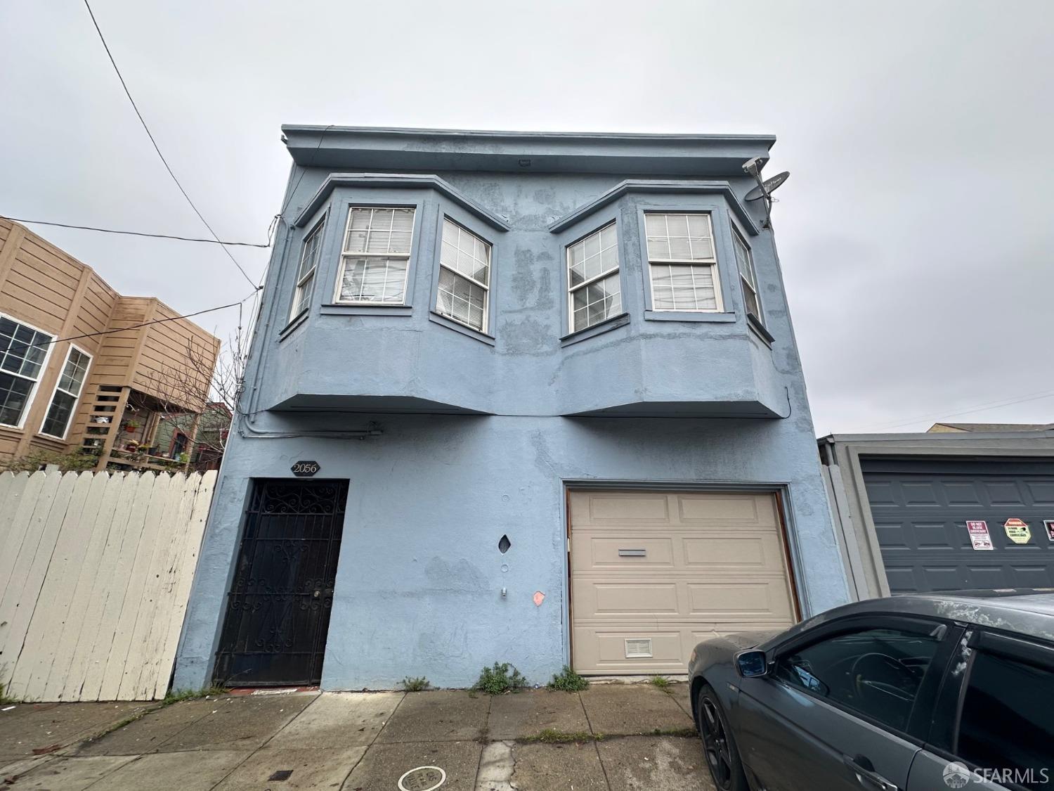 a car parked in front of a house