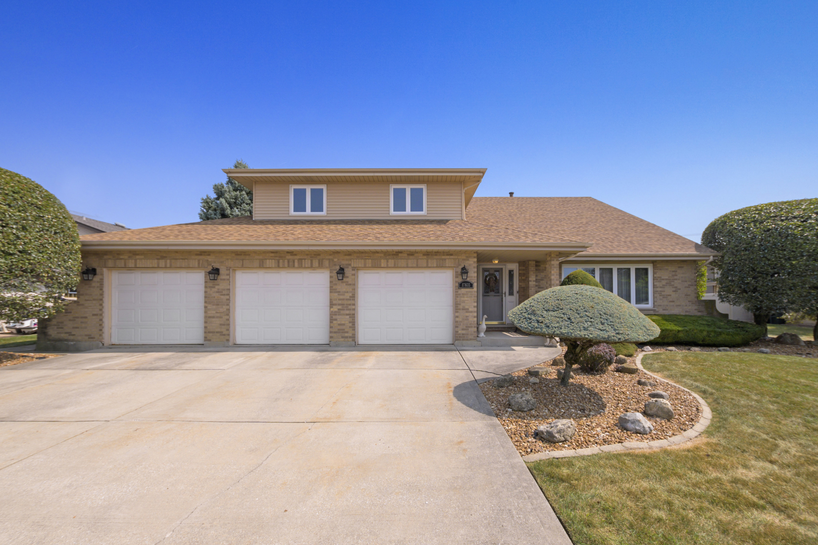 a front view of a house with yard